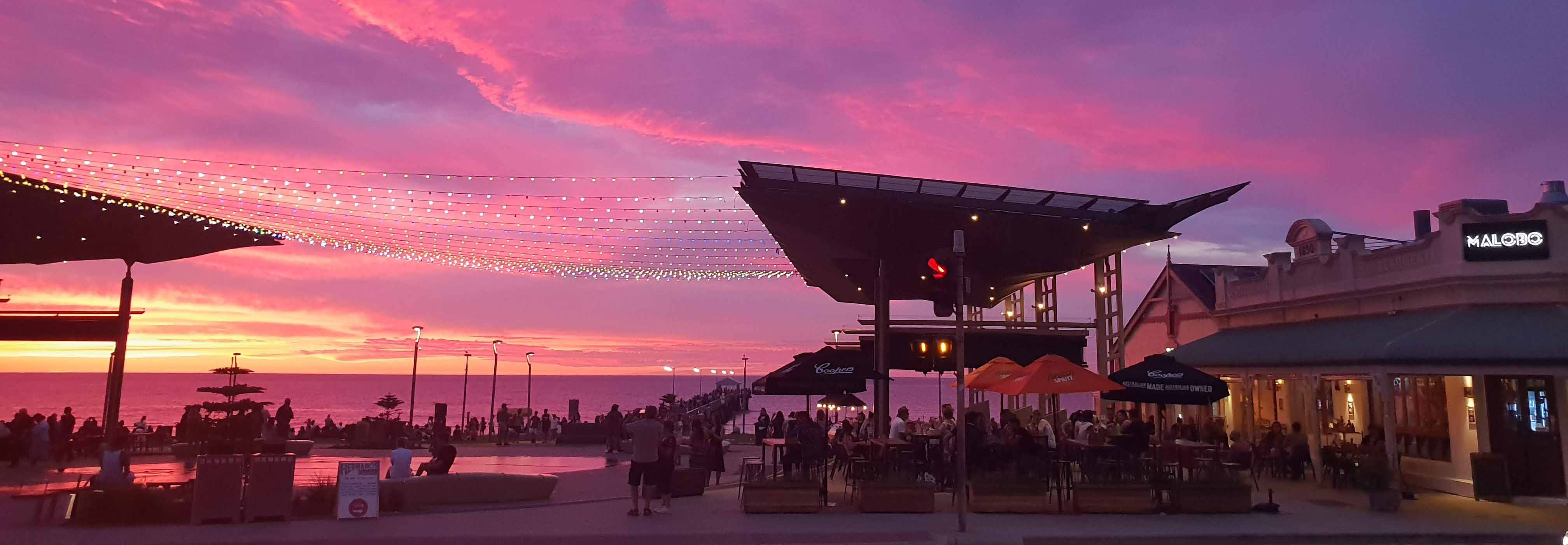 Vibrant cafe interior and beach view at MALOBO